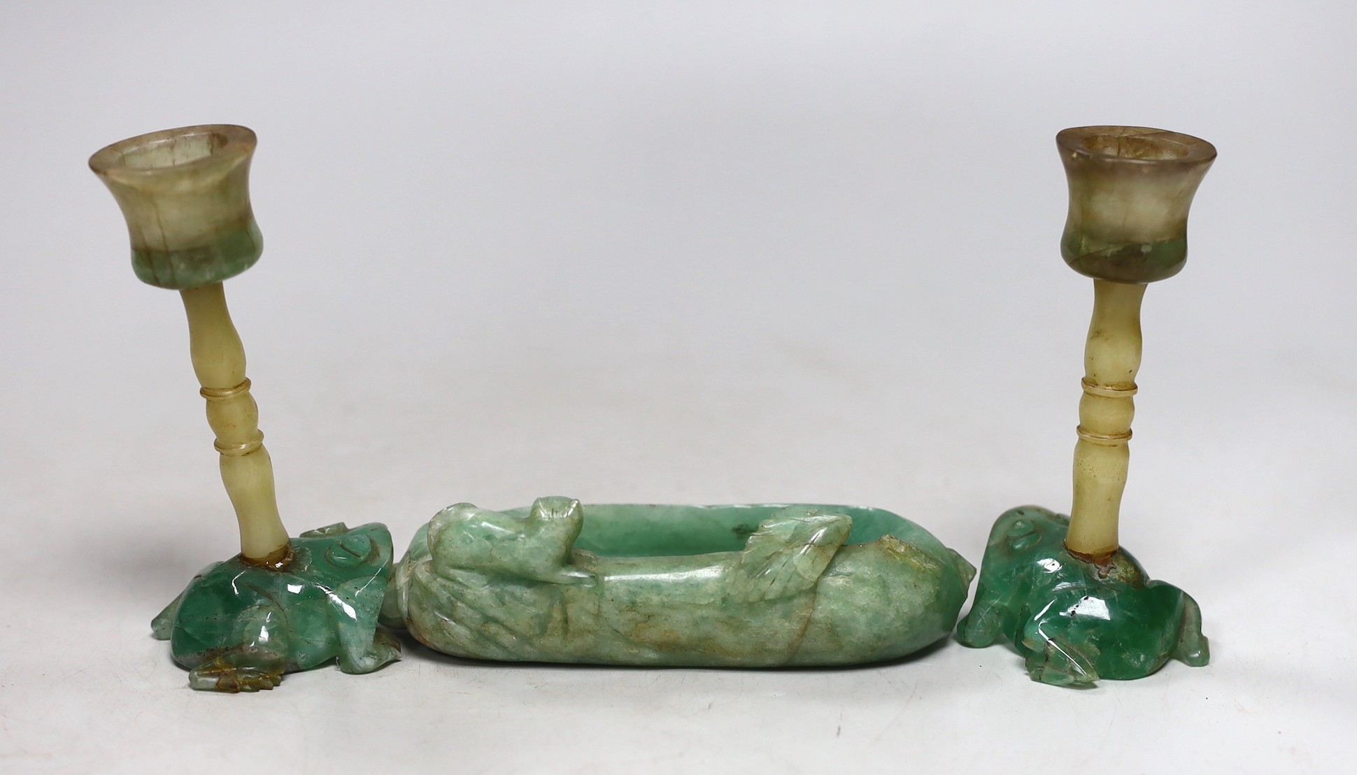 A pair of Chinese jade stemmed and green quartz candlesticks and a green quartz brushwasher, 12cms wide (3)